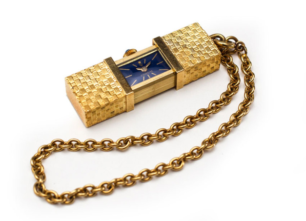 Montre de sac en or jaune de chez Corum, années 60 Montre de sac en or jaune de chez Corum, années 60