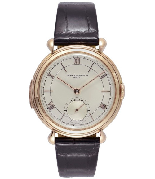 1941 - Montre-bracelet homme, répétition-minute. Or rose 18K, anses gouttes, verrou de répétition sur la carrure, cadran argenté, chiffres romains et index bâtons or rose, petite seconde à 6h.