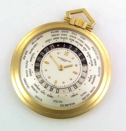 1949 - Montre de poche "Heure Universelle". Or jaune 18K, cadran argenté 3 zones, index or jaune, zone extérieure avec indication de 41 grandes villes du monde, disque 24h tournant.