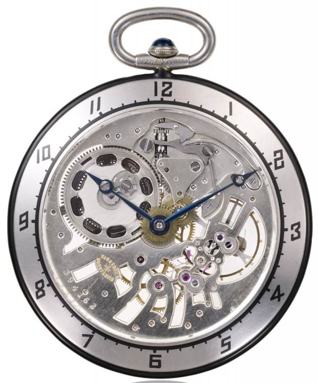 1926 - Montre de poche, or gris 18K, cristal de roche, émail et couronne cabochon onyx. Mouvement squelette maillechort.