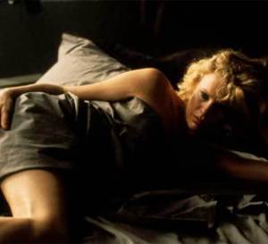 Neuf semaines et demie : Kim Basinger porte une Cartier Santos en or jaune
